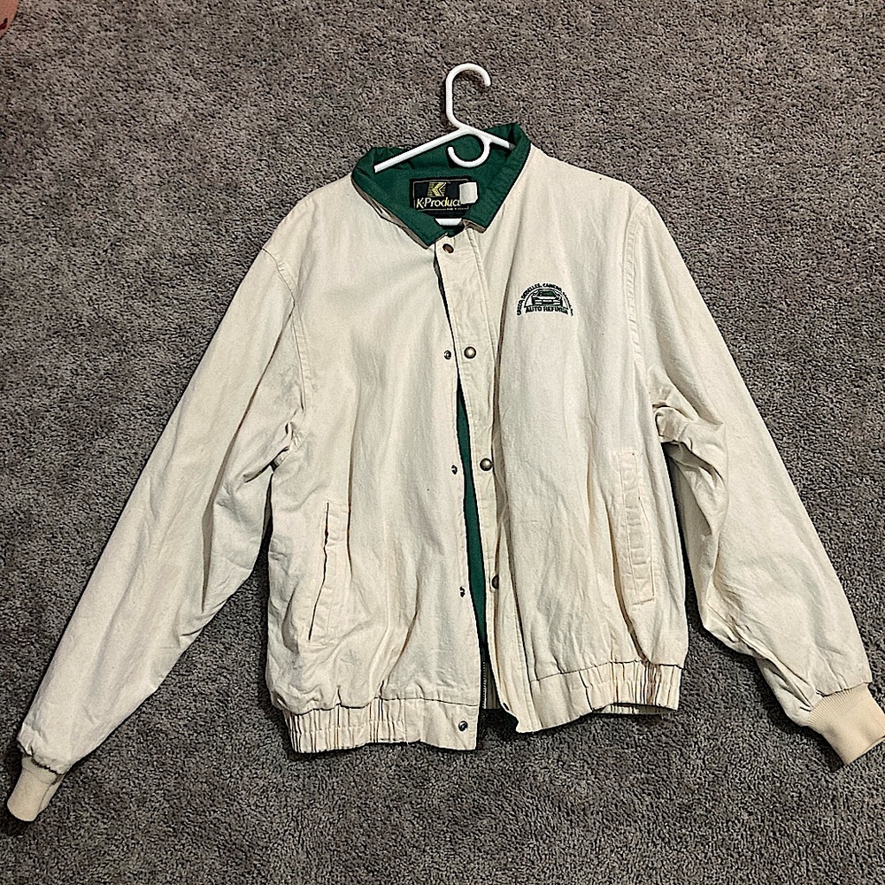 Tan and green jacket.